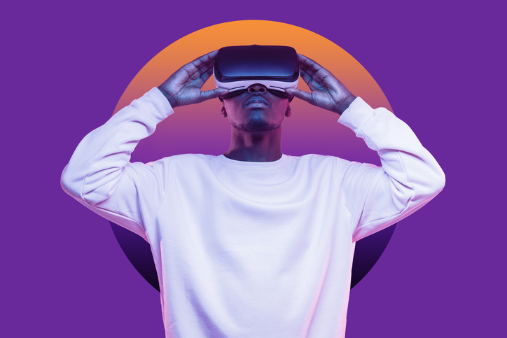 African American Man Looking Up At Virtual Reality Or Metaverse In Vr Glasses Isolated On Purple - Coming Soon To An ...