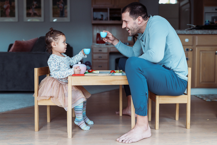 Toddler Girl And Dad Toast While Having Tea Party - Dad's Day
