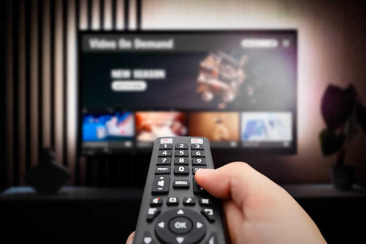 Man Watching Tv With Remote Control In Hand. - It's Not Me, It's You: A Guide To Cord Cutting, Cable TV And Streaming