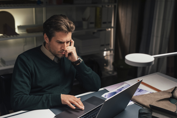 Overtime: Young Male Software Engineer Working On A Programming Task From His Office Late At Night - Not Making A Cal...