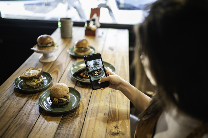 Influencer Woman Filming The Hamburger Table - You Can't Unsee This: Has KFC's New Influencer Jumped The Shark?